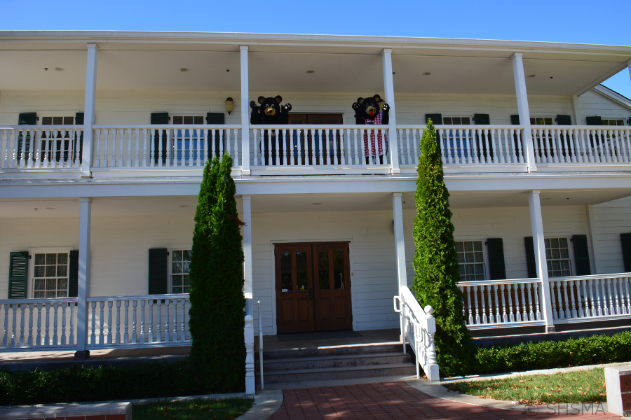 the bears wave from the upper porch