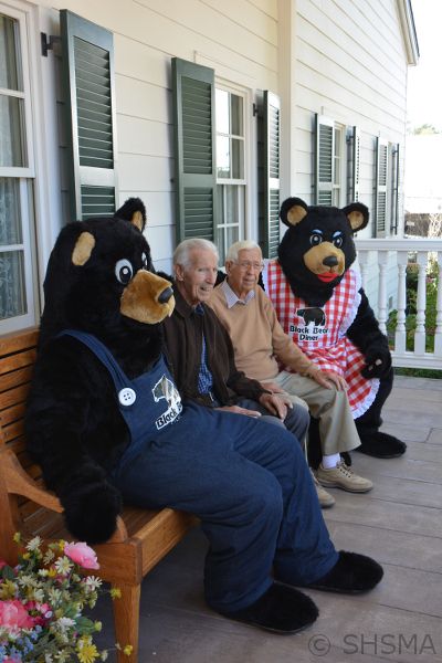 Nick and Ray Tikvica relaxing on the porch of the museum with Papa and Mama Bear