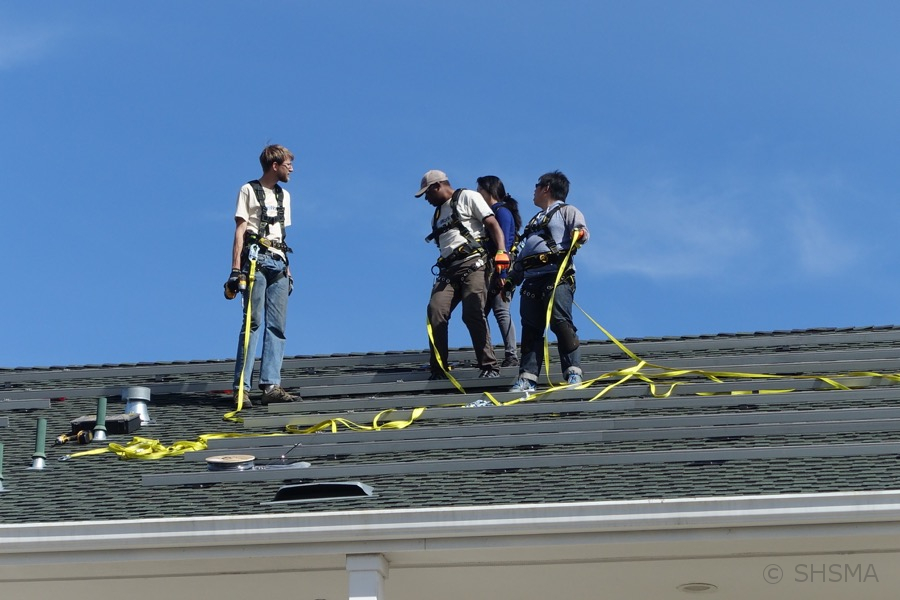 Closeup of SunWork installation team on the roof